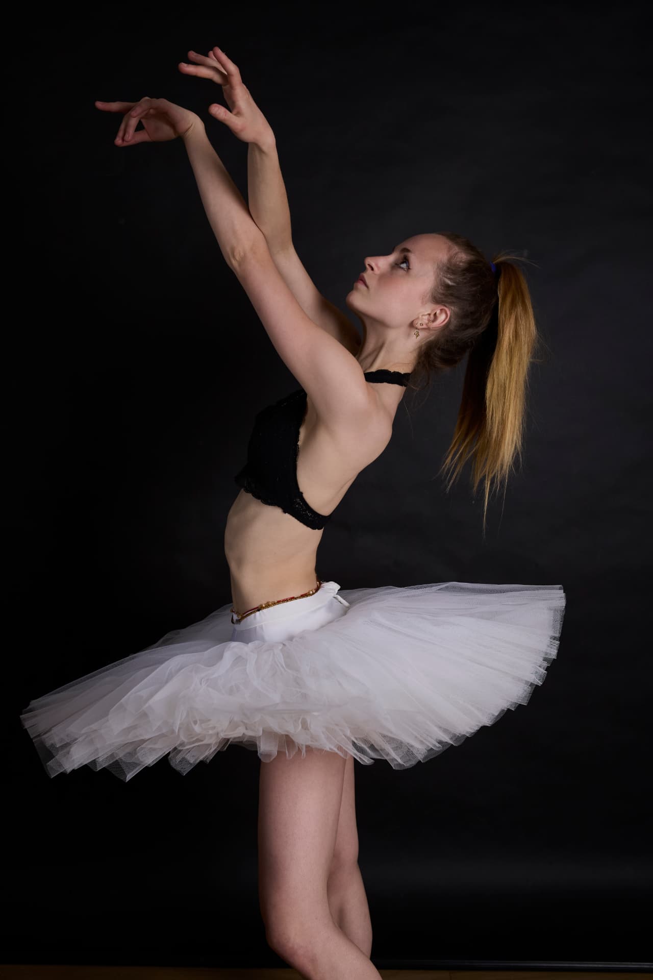 Ballet performance under warm spotlight