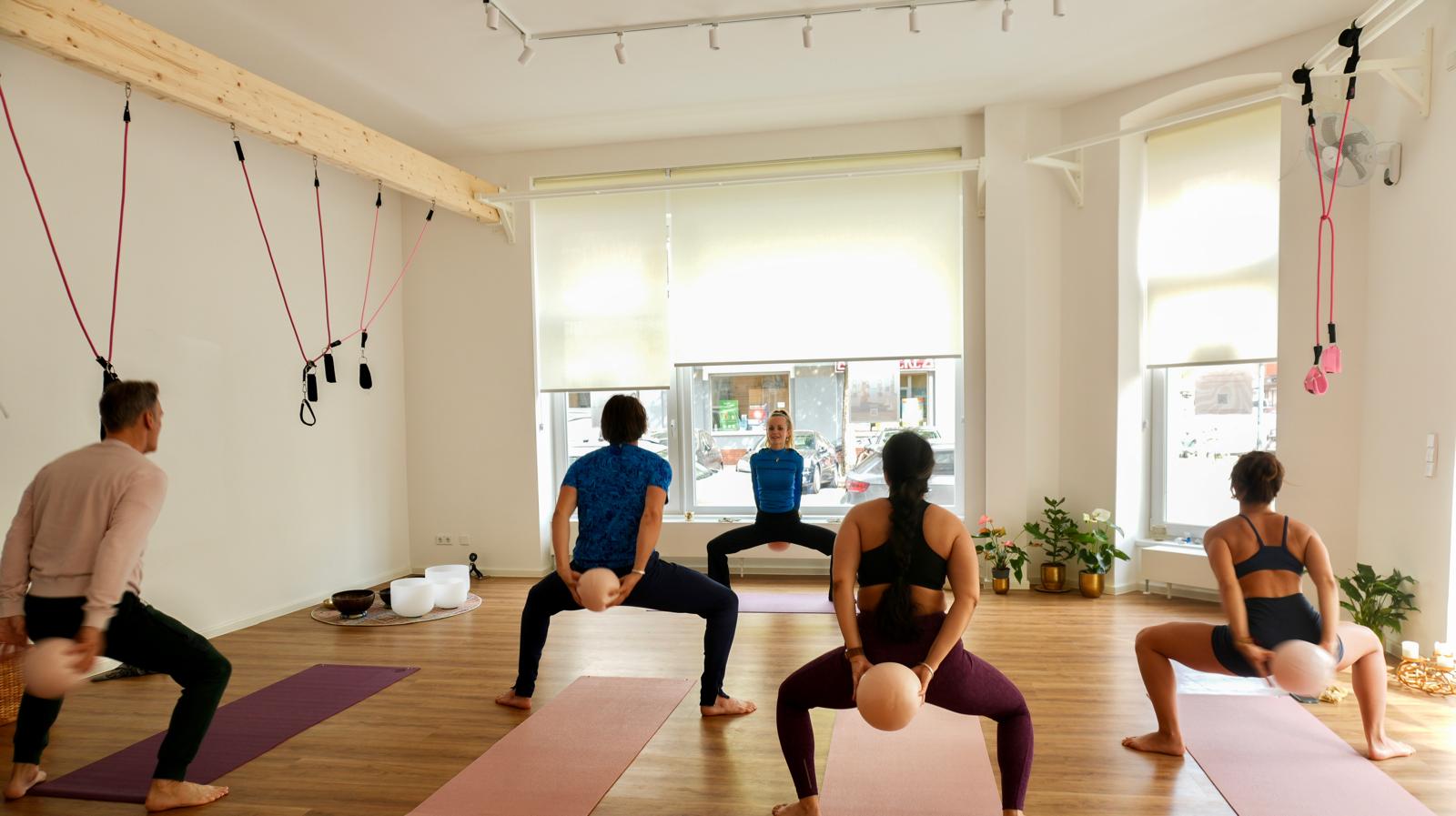Pilates in arched window light